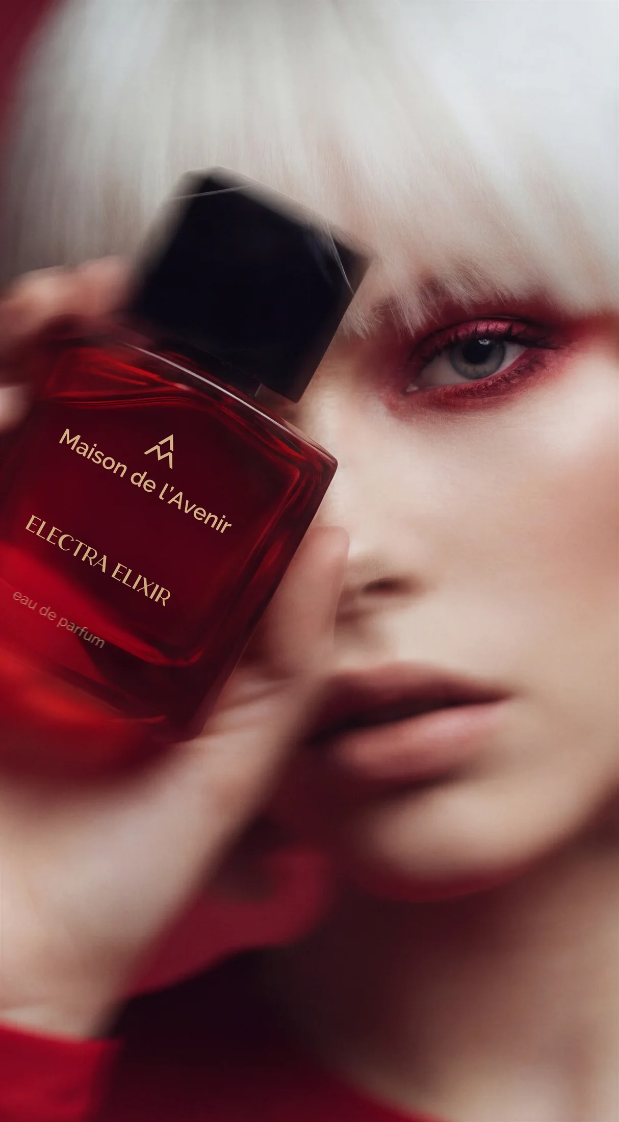 Electra Elixir perfume bottle and close-up beauty portrait